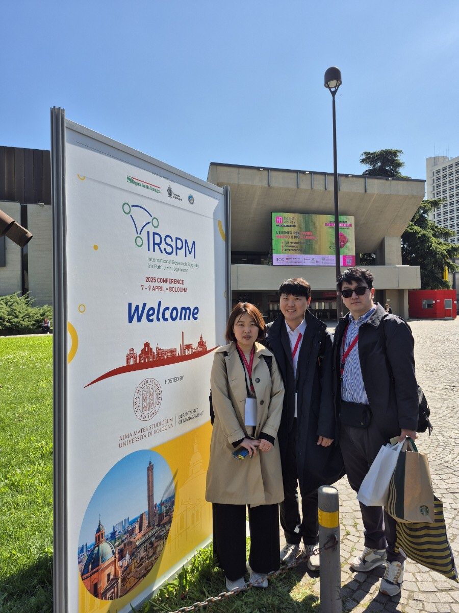 At the IRSPM 2025 welcome board in Bologna
